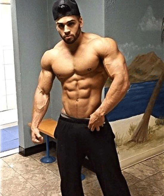muscle guy wearing pants and cap