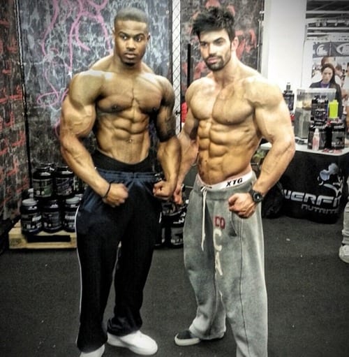 bodybuilders in gym no shirt on